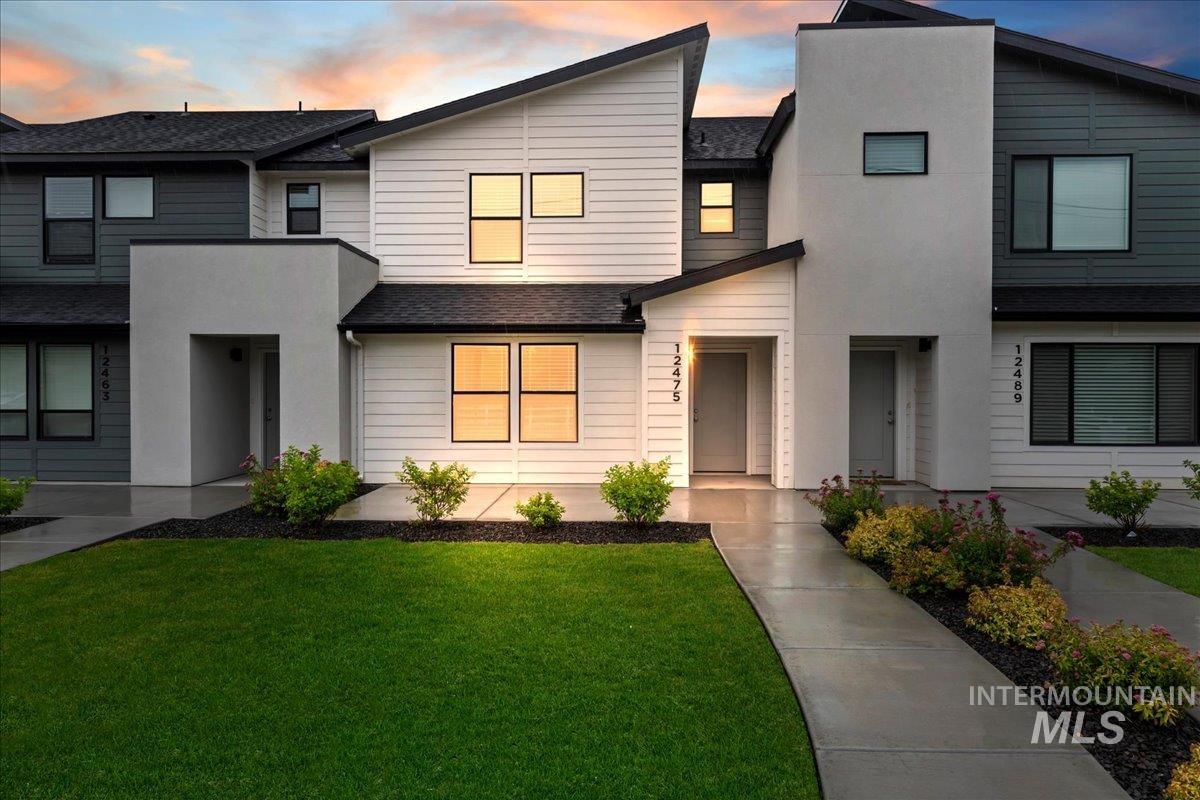 12475 West Victory Road Boise, ID 83709 - Photo 2 of 26 Contemporary townhome exterior featuring a striking architectural design