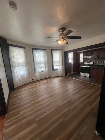 a view of livingroom and kitchen with hardwood floor