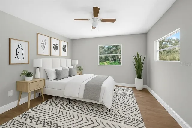 a bedroom with a large bed and a window