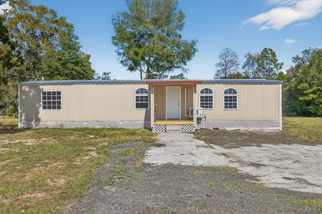 a view of backyard with green space