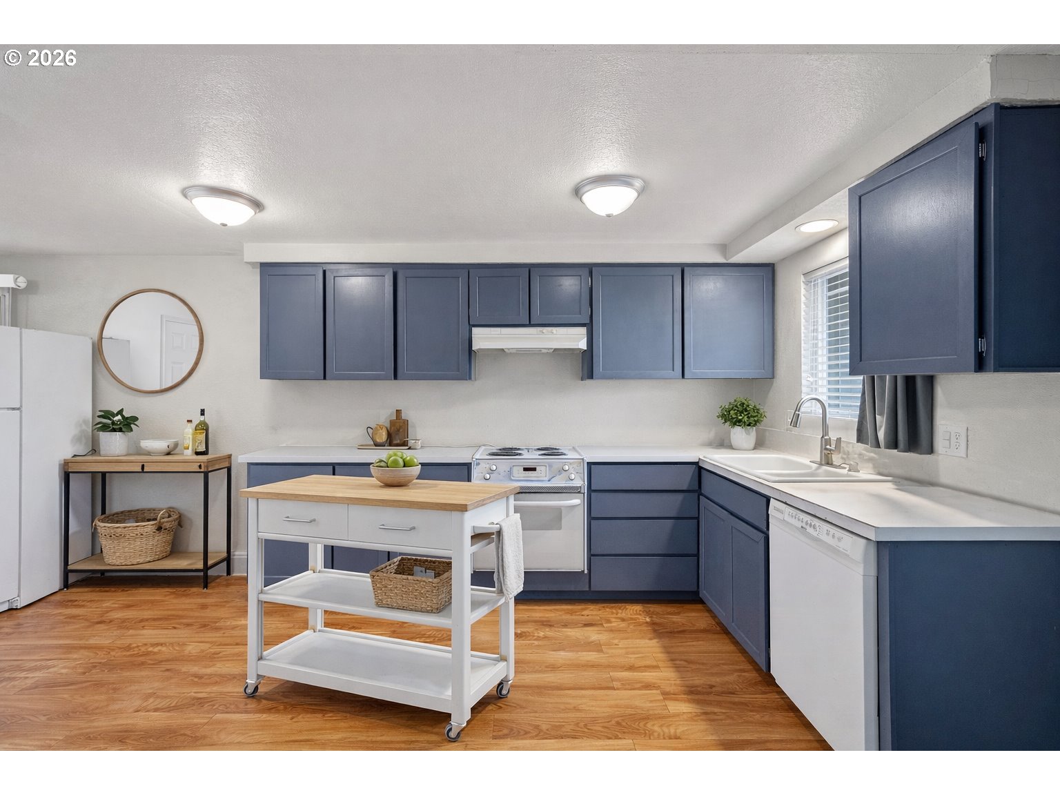 775 54th Street Springfield, OR 97478 - Photo 3 of 31 a kitchen with a sink cabinets and wooden floor