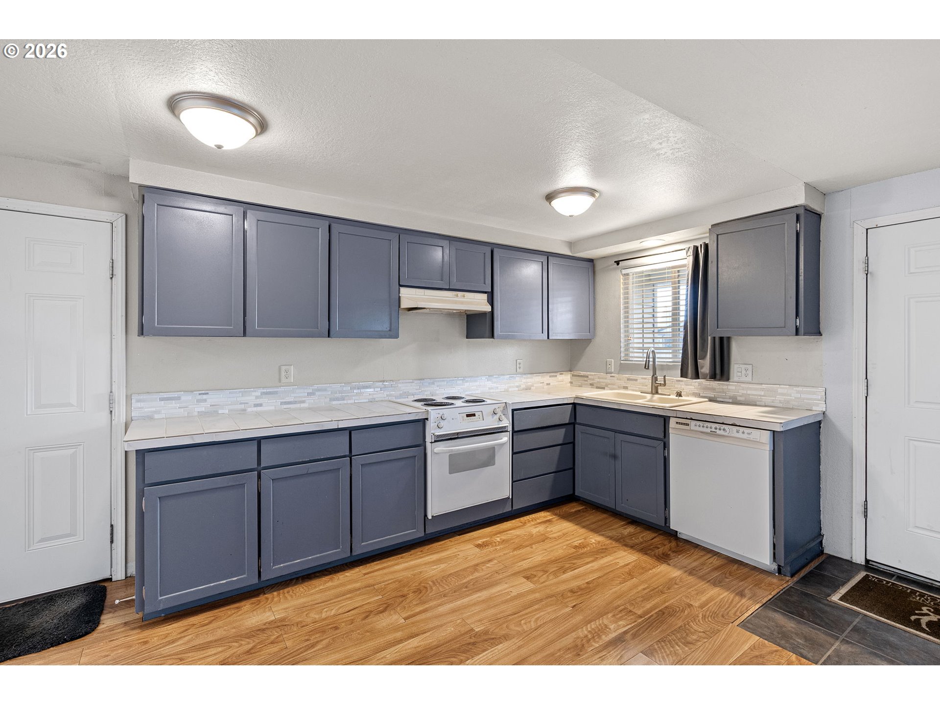 775 54th Street Springfield, OR 97478 - Photo 5 of 31 a kitchen with a sink appliances and cabinets