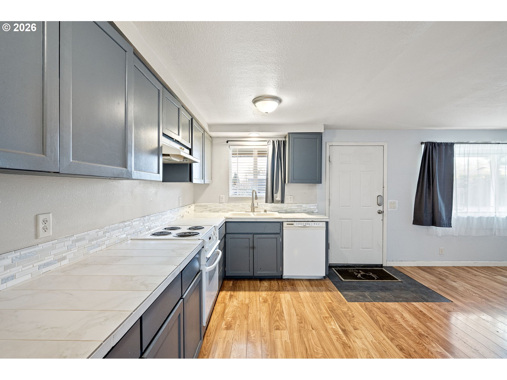 775 54th Street Springfield, OR 97478 - Photo 6 of 31 a kitchen with a sink stove and cabinets
