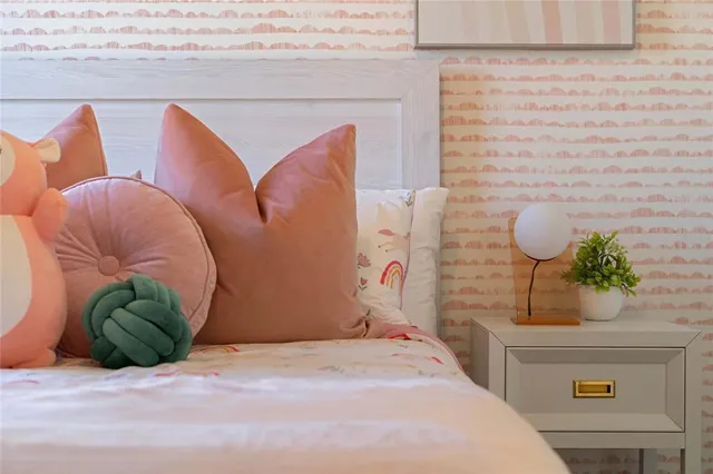 a bedroom with a bed and ceiling fan