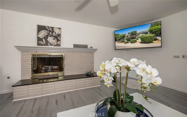 a view of living room with furniture and flowers
