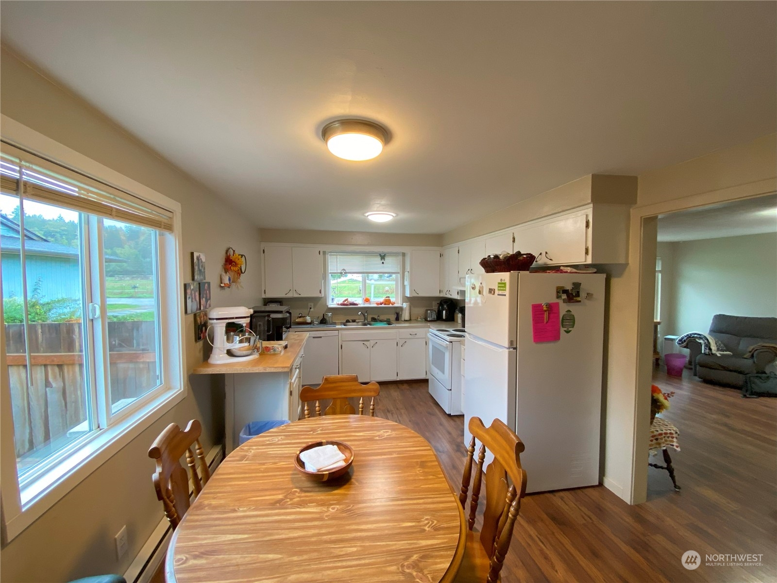 522 Russell Road Snohomish, WA 98290 - Photo 16 of 23 a room with stainless steel appliances kitchen island granite countertop furniture and a refrigerator