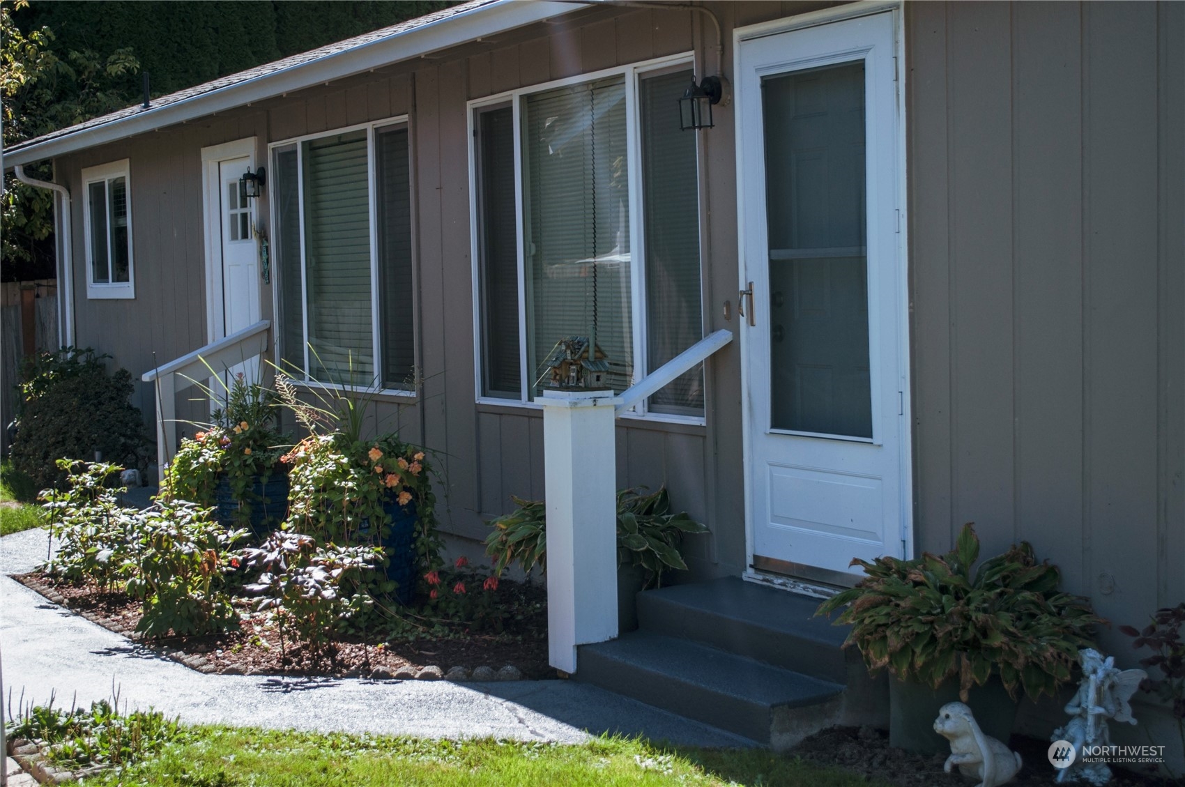 522 Russell Road Snohomish, WA 98290 - Photo 3 of 23 a view of a house with backyard and garden