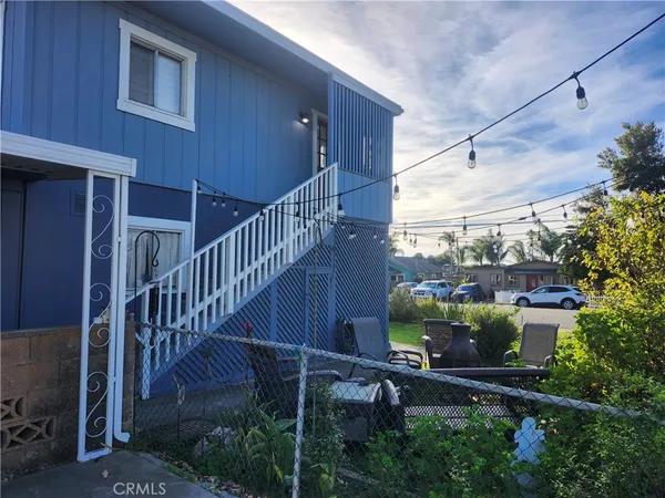 a view of a balcony with a tree
