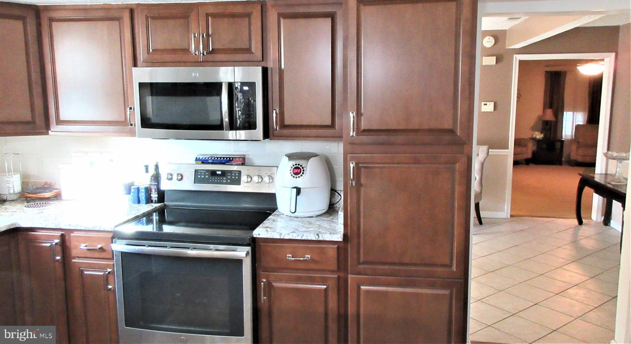 8202 Grainfield Road Severn, MD 21144 - Photo 16 of 37 Hardwood, granite & Stainless