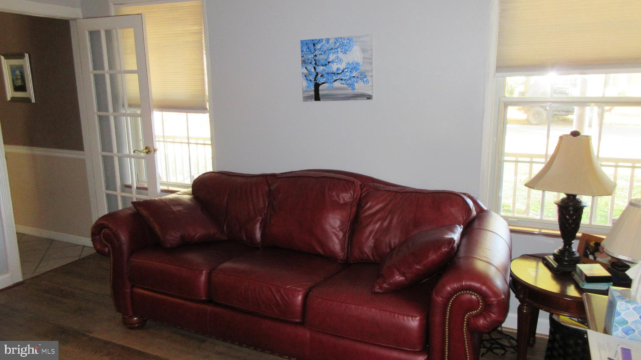 8202 Grainfield Road Severn, MD 21144 - Photo 22 of 37 Living room #1 with upgraded flooring