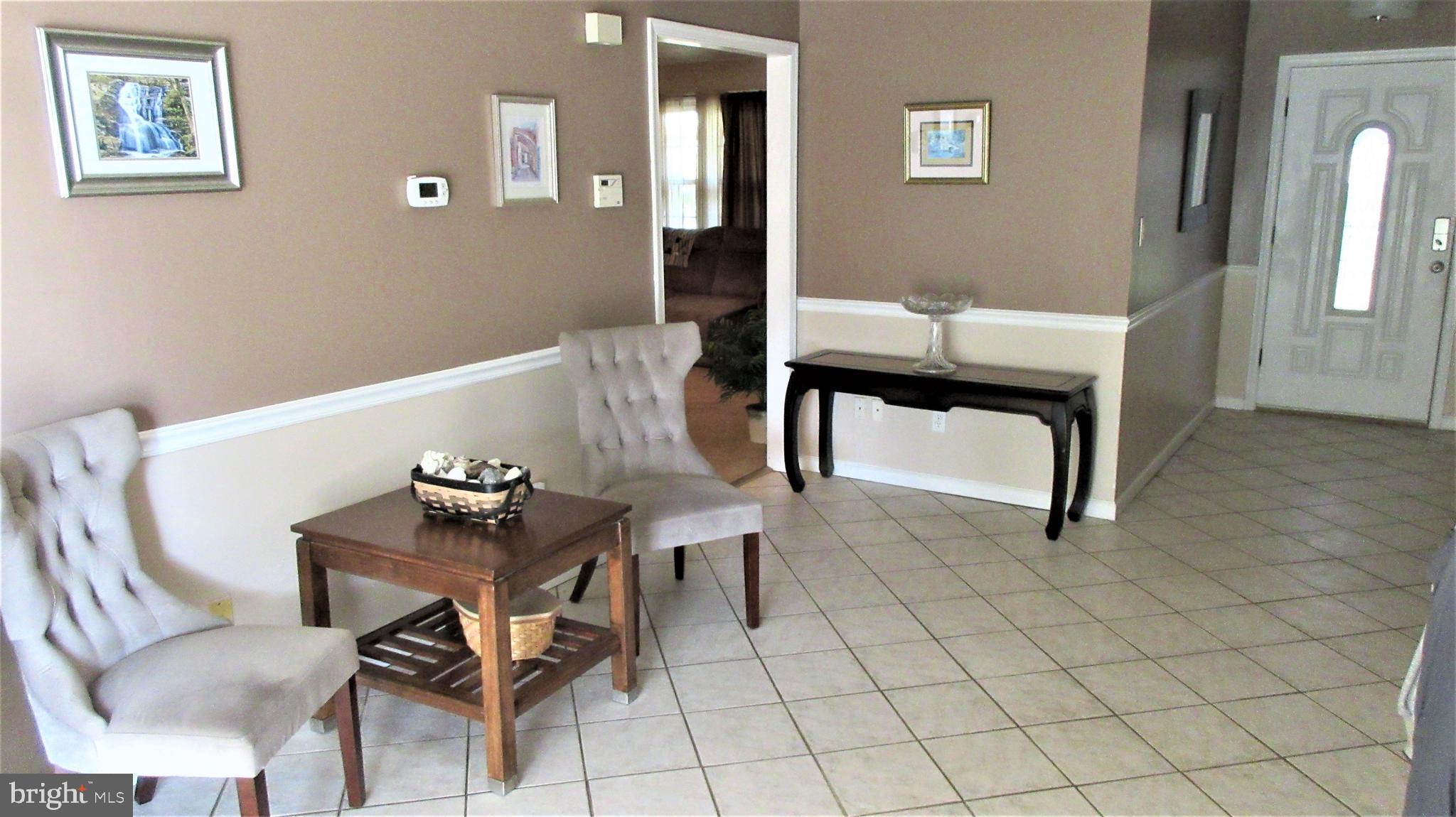 8202 Grainfield Road Severn, MD 21144 - Photo 4 of 37 Large tiled foyer or dining room