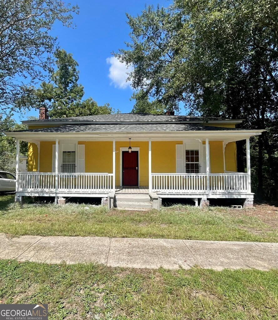 511 Smith Street Dublin, GA 31021 - Photo 1 of 1 a view of a house with a yard and fence