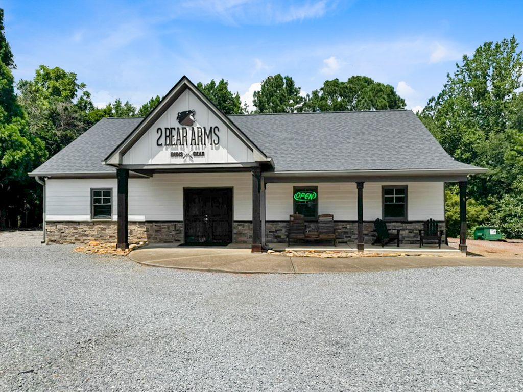 100 Pearidge Road Canton, GA 30114 - Photo 2 of 16 a front view of a house with a yard and garage