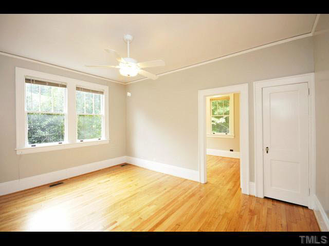 1821 White Oak Road Raleigh, NC 27608 - Photo 12 of 25 a view of an empty room with a window