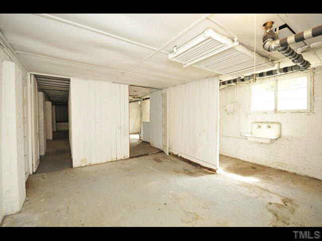 1821 White Oak Road Raleigh, NC 27608 - Photo 19 of 25 a view of a room with a wooden shelves