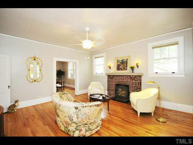 1821 White Oak Road Raleigh, NC 27608 - Photo 2 of 25 a living room with furniture and a fireplace