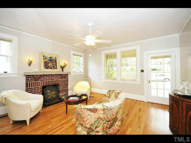 1821 White Oak Road Raleigh, NC 27608 - Photo 4 of 25 a living room with furniture and a fireplace