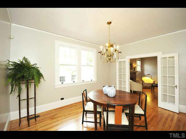1821 White Oak Road Raleigh, NC 27608 - Photo 7 of 25 a view of a dining room with furniture and a chandelier