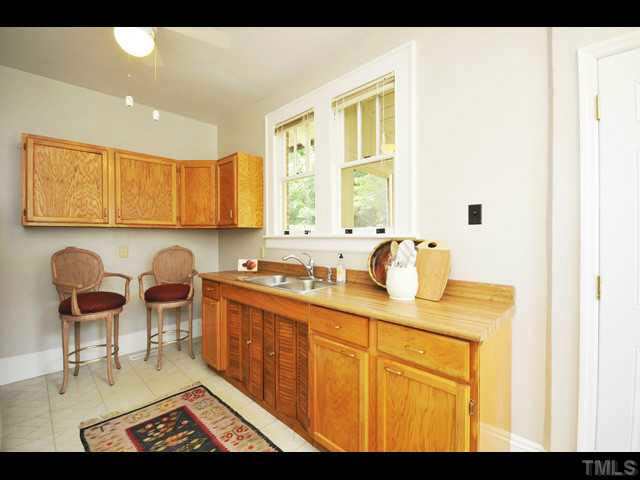 1821 White Oak Road Raleigh, NC 27608 - Photo 8 of 25 a kitchen with a sink and cabinets