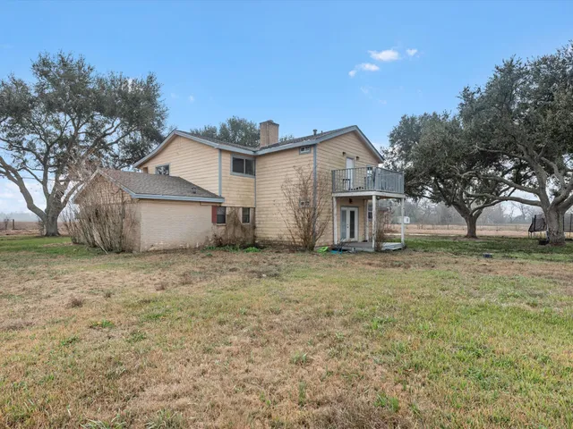 a house view with a backyard space