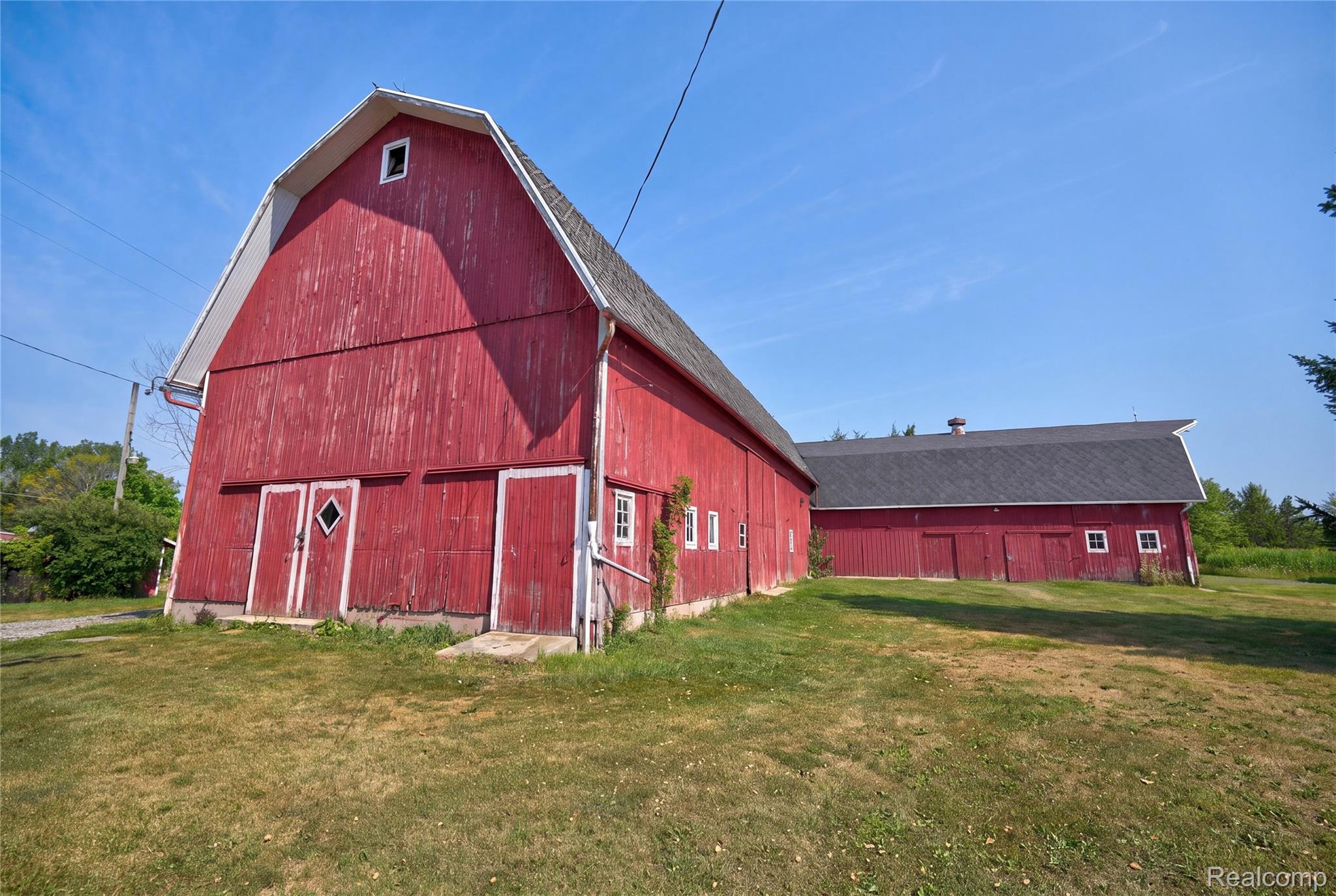 1175 South Morrish Road Flint, MI 48532 - Photo 10 of 72 Two red barns with dark shingle roofs