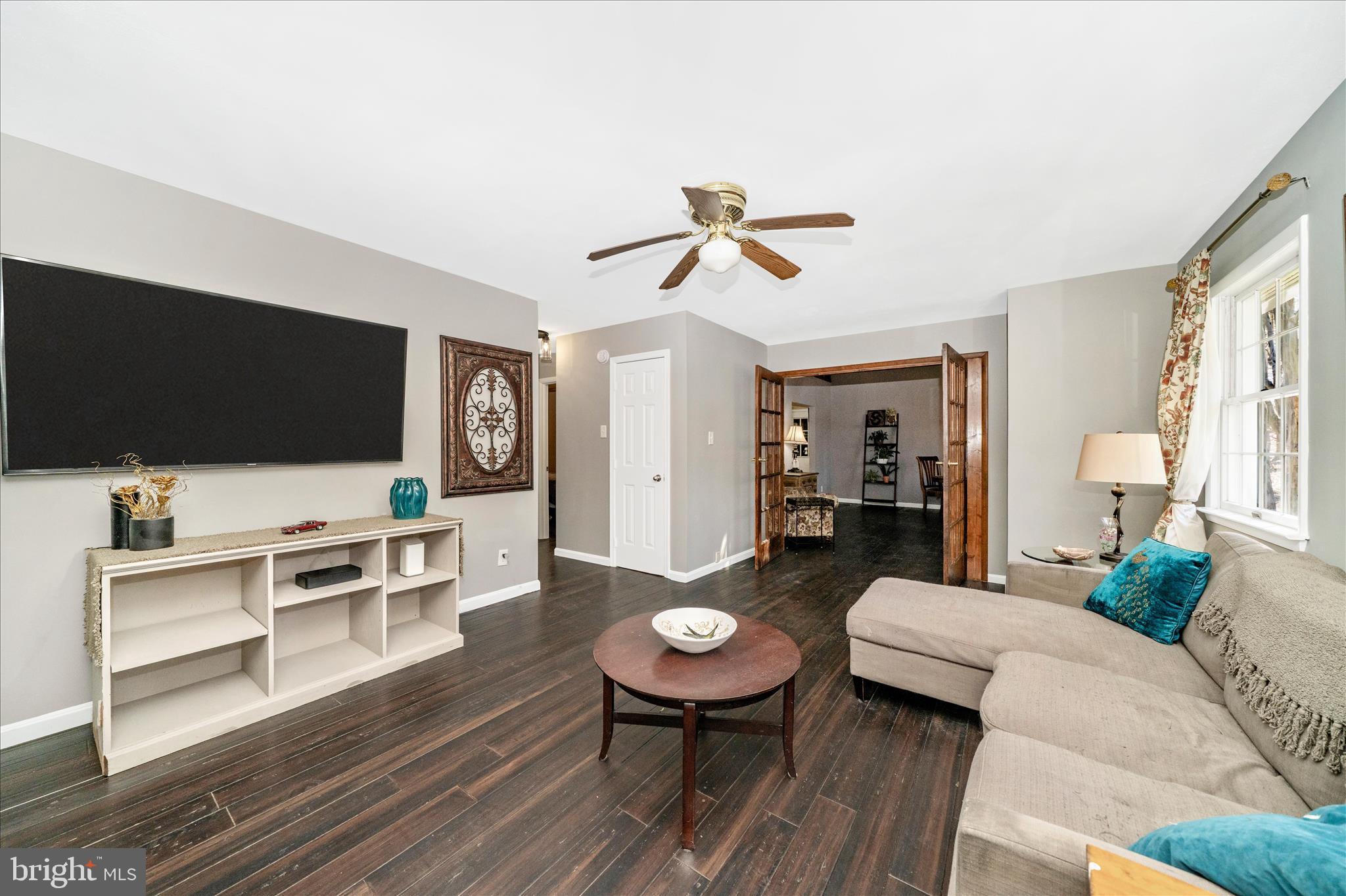 15211 Avery Road Rockville, MD 20855 - Photo 15 of 60 a living room with furniture and a flat screen tv