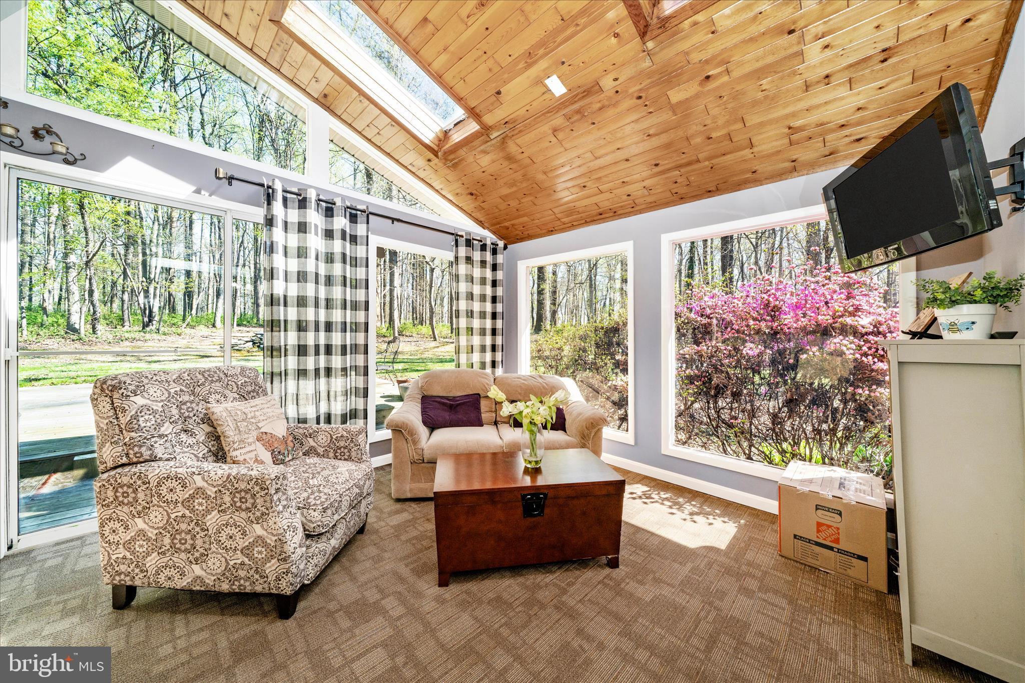 15211 Avery Road Rockville, MD 20855 - Photo 24 of 60 a living room with furniture and a flat screen tv