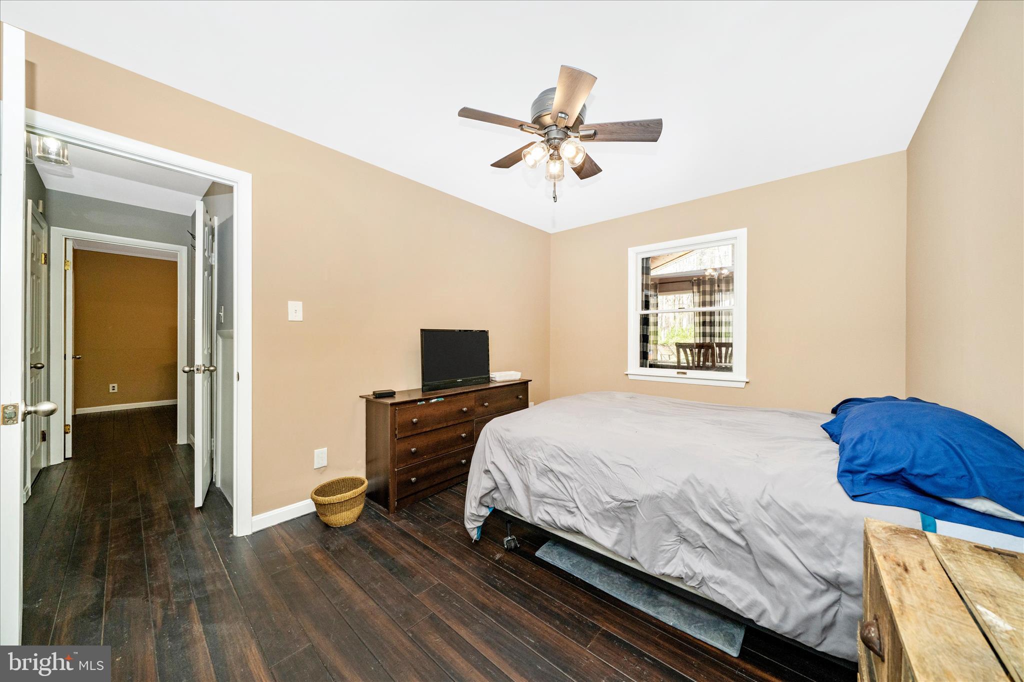 15211 Avery Road Rockville, MD 20855 - Photo 26 of 60 a bedroom with a bed and wooden floor