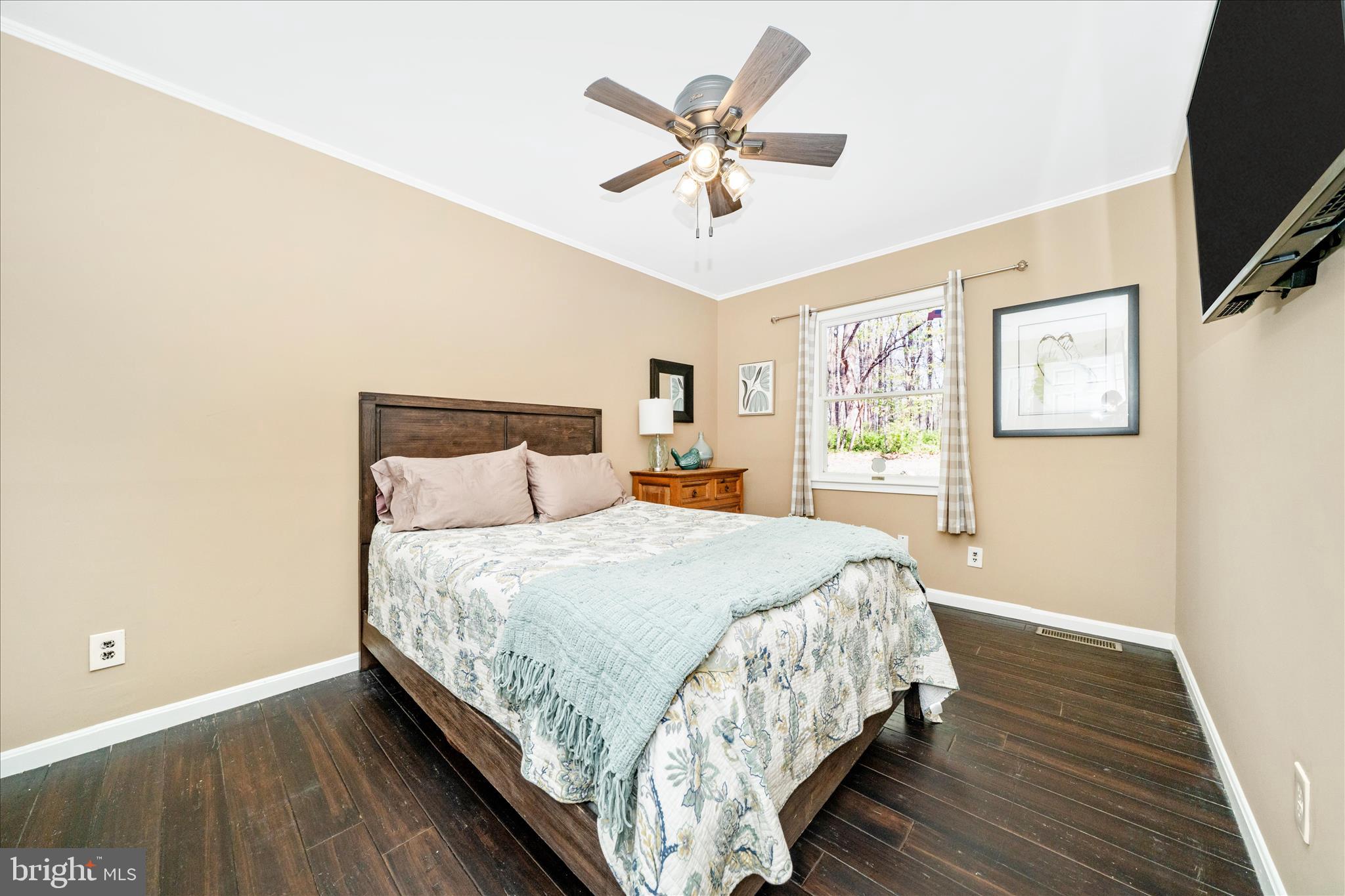 15211 Avery Road Rockville, MD 20855 - Photo 27 of 60 a bedroom with bed and window