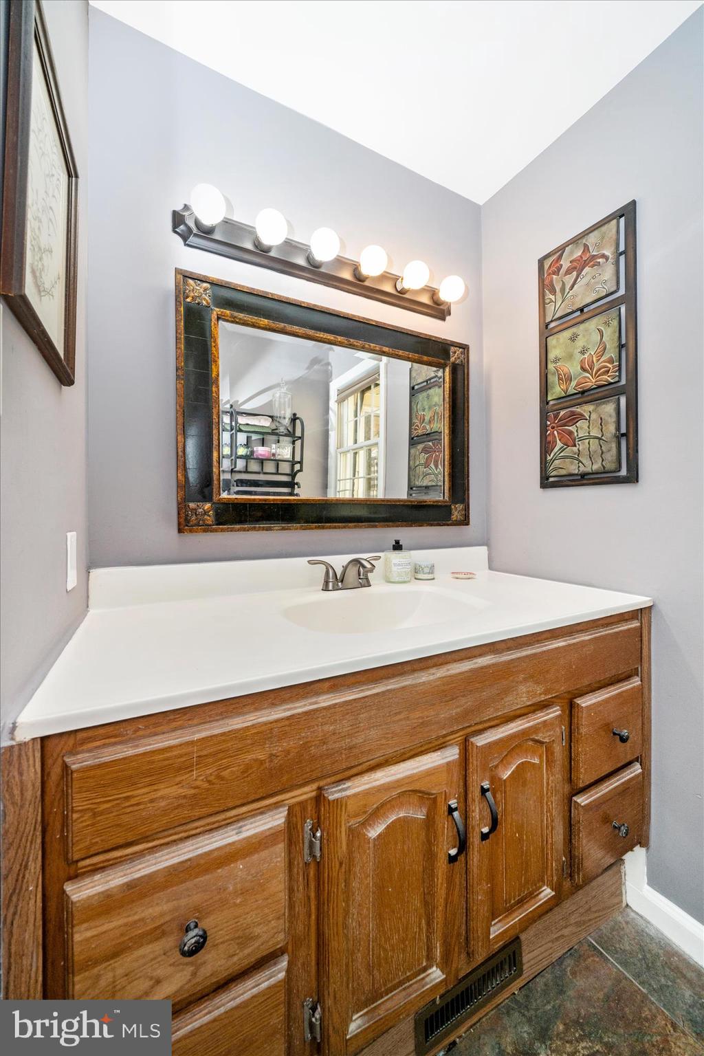 15211 Avery Road Rockville, MD 20855 - Photo 29 of 60 a bathroom with a sink and a mirror