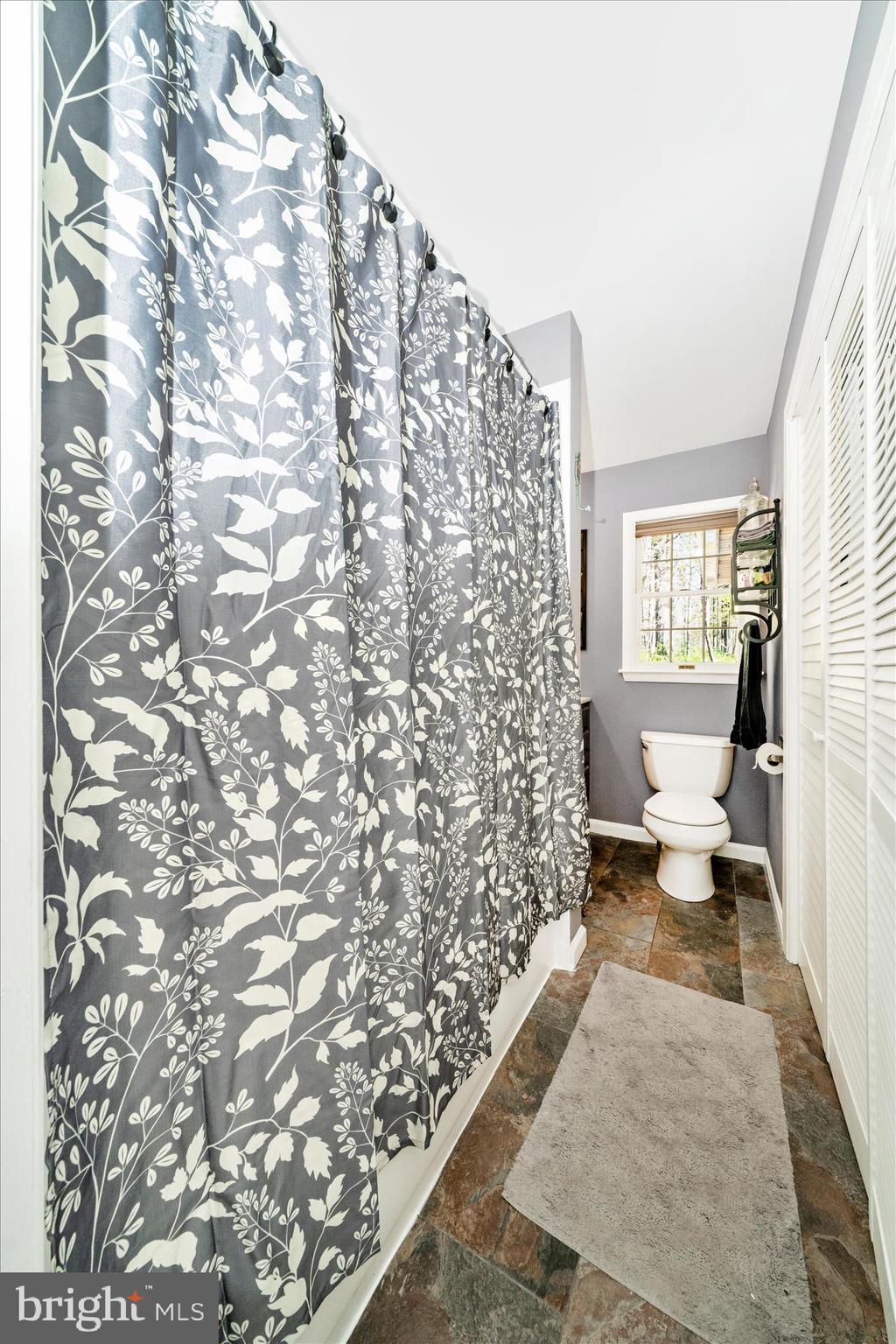 15211 Avery Road Rockville, MD 20855 - Photo 30 of 60 a living room with a couch and a rug