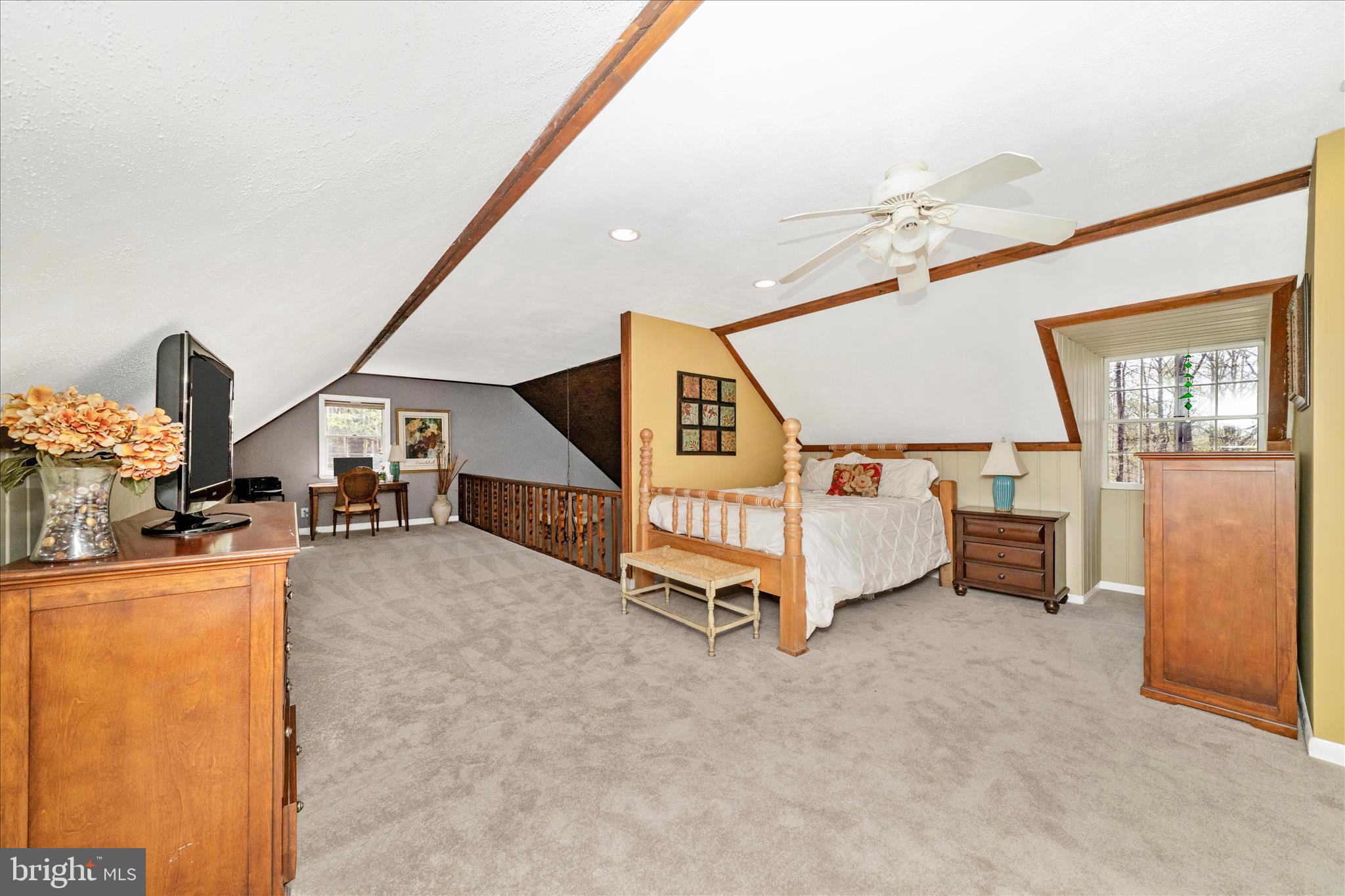 15211 Avery Road Rockville, MD 20855 - Photo 37 of 60 a spacious bedroom with a bed and a table