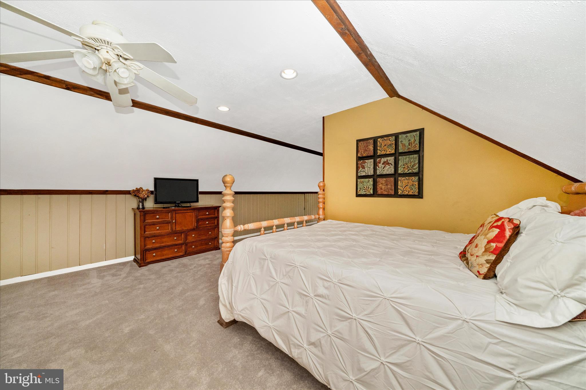 15211 Avery Road Rockville, MD 20855 - Photo 38 of 60 a bedroom with a bed and a flat screen tv