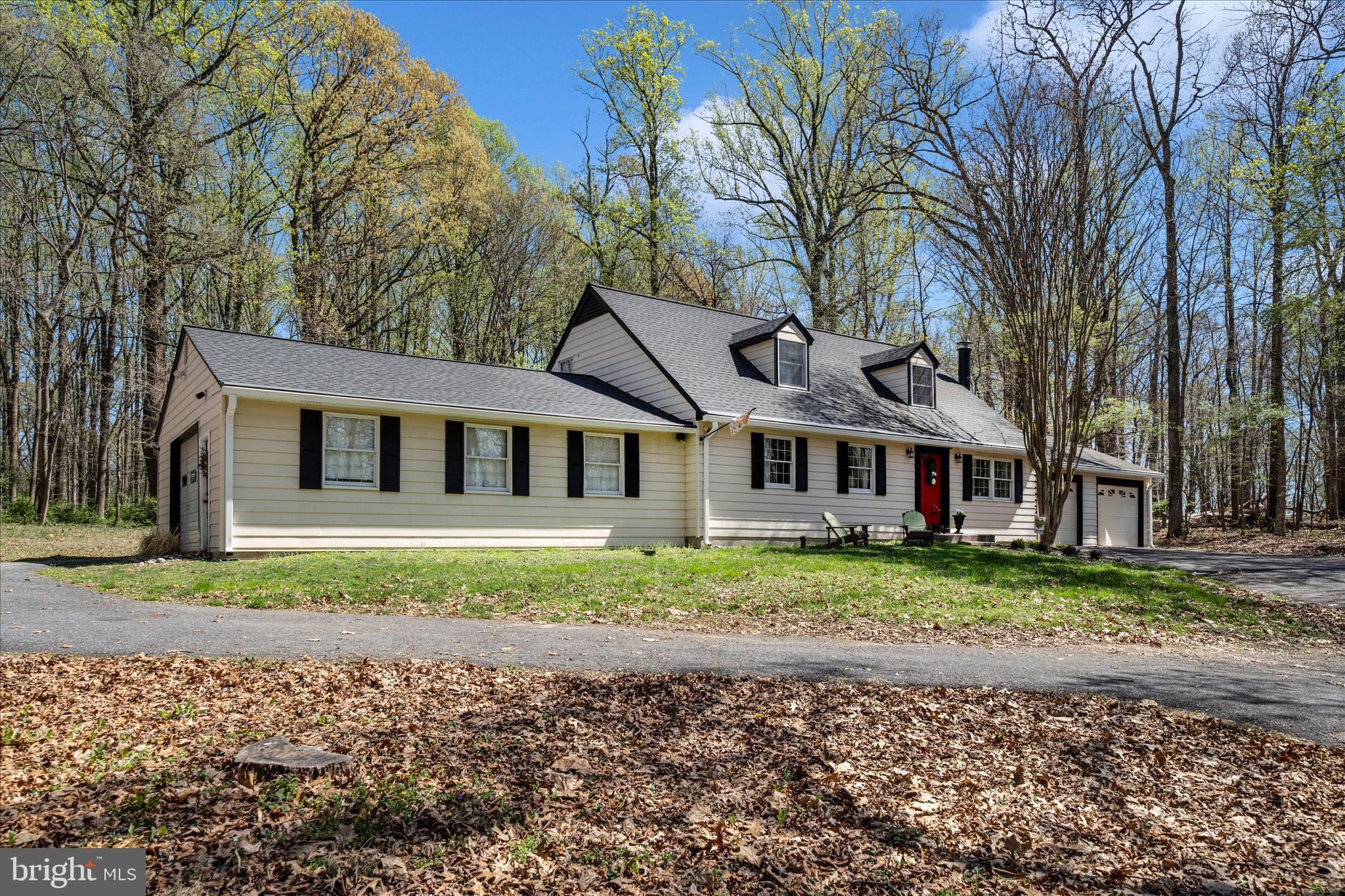 15211 Avery Road Rockville, MD 20855 - Photo 60 of 60 a white house that has a tree in front of it
