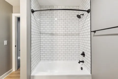 a bathroom with a shower and a bathtub