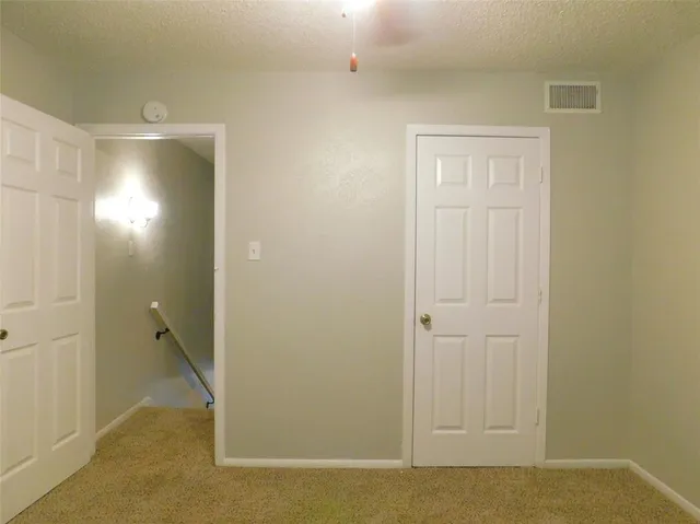 an empty room with an entryway door