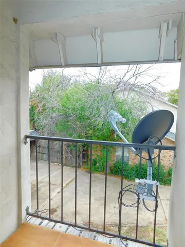 a view of a chairs and table in patio