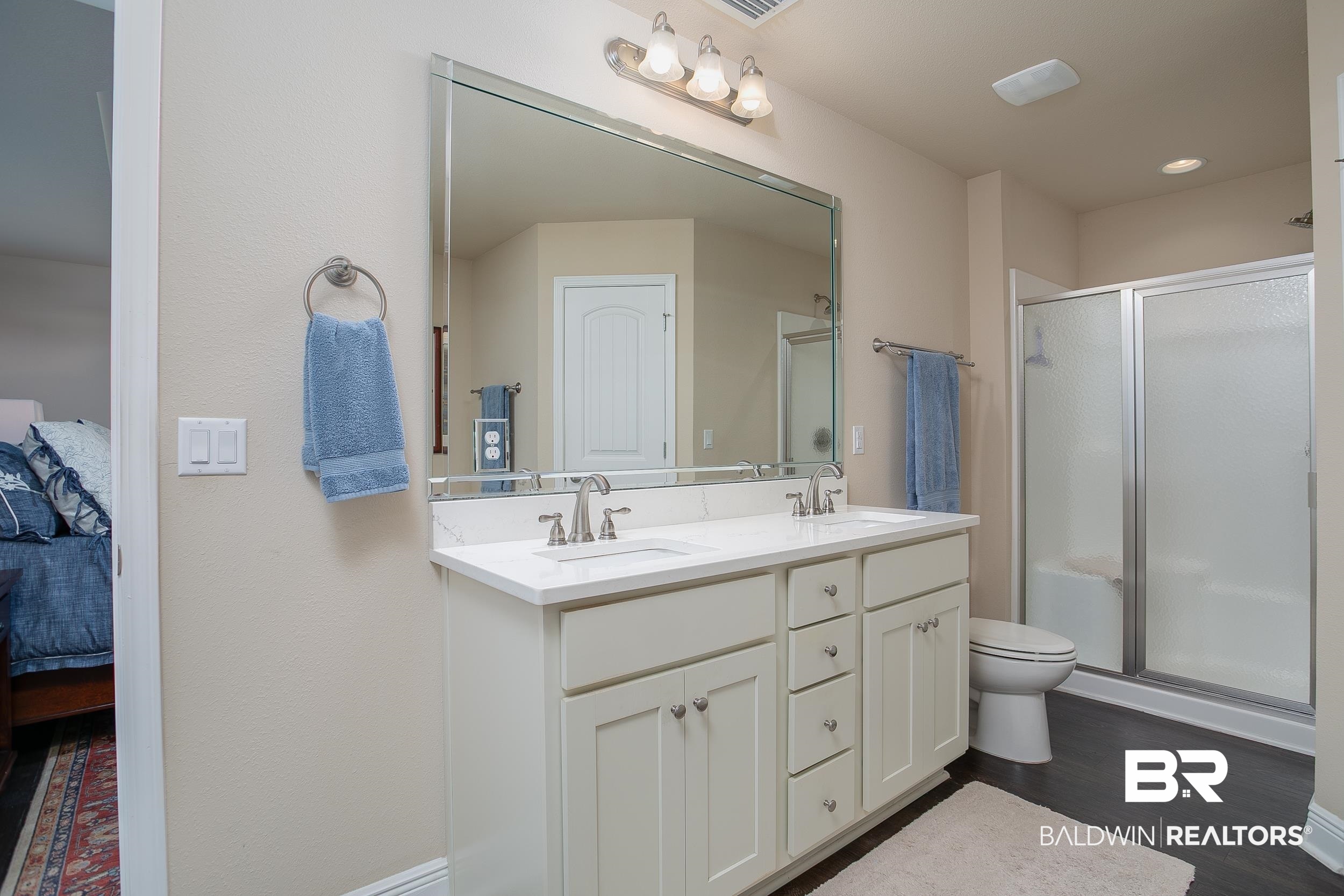 13154 Vincent Court Foley, AL 36535 - Photo 18 of 41 Ensuite bathroom with connected bathroom, a sink, and a shower stall