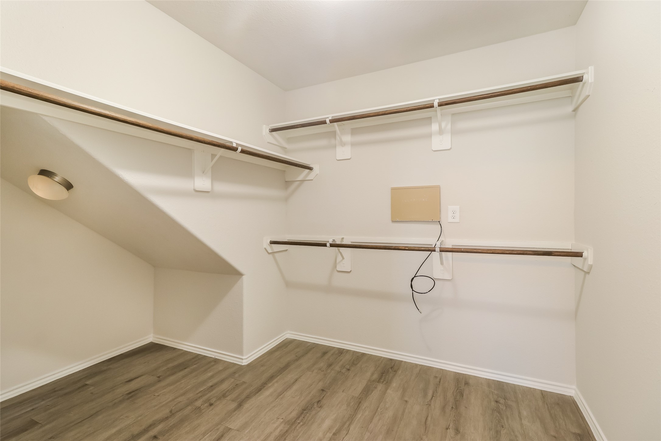 3229 Chunk Court Conroe, TX 77301 - Photo 11 of 18 a view of a room with racks on the wall