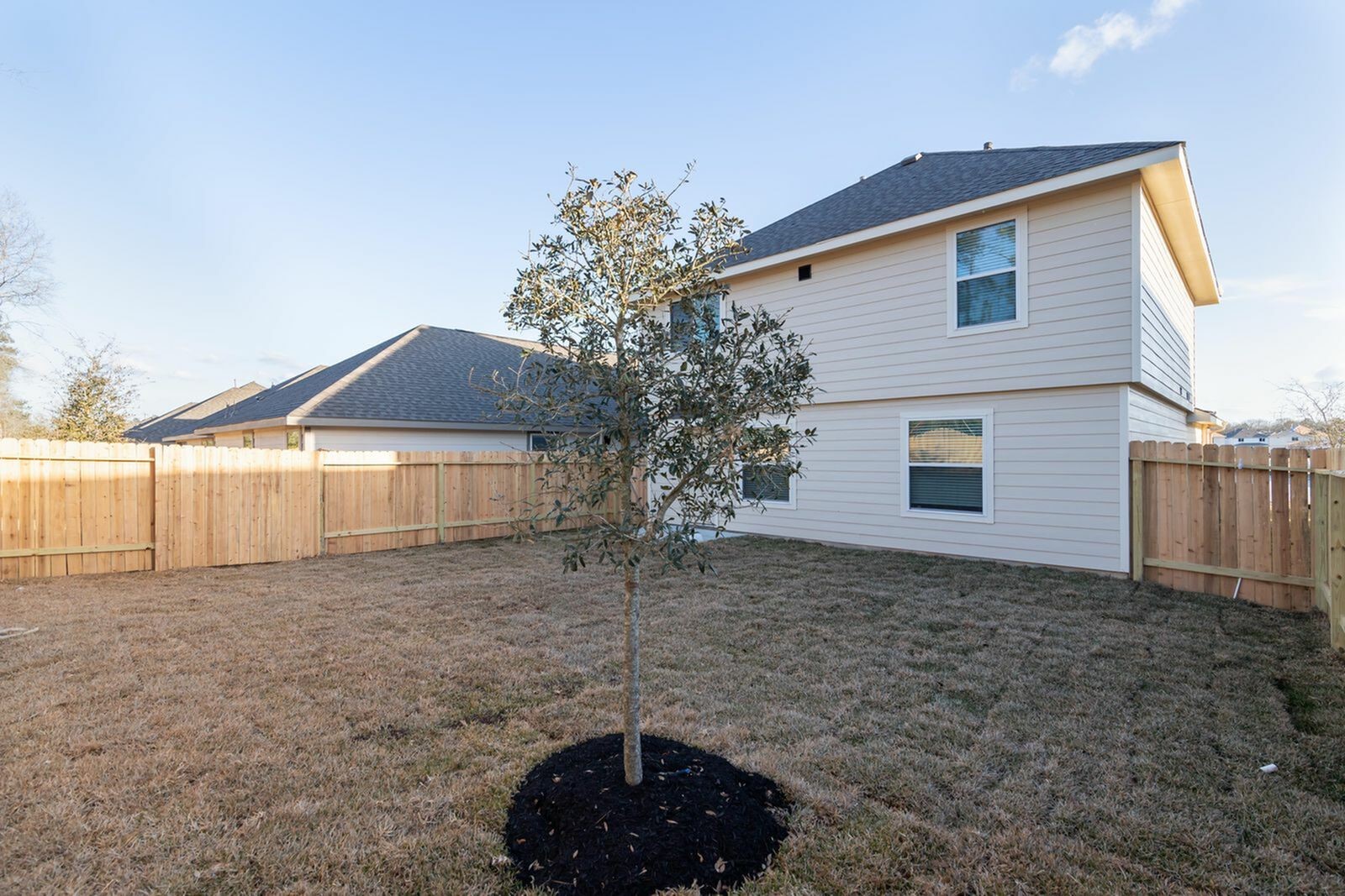 3229 Chunk Court Conroe, TX 77301 - Photo 2 of 18 a front view of a house with a yard and garage