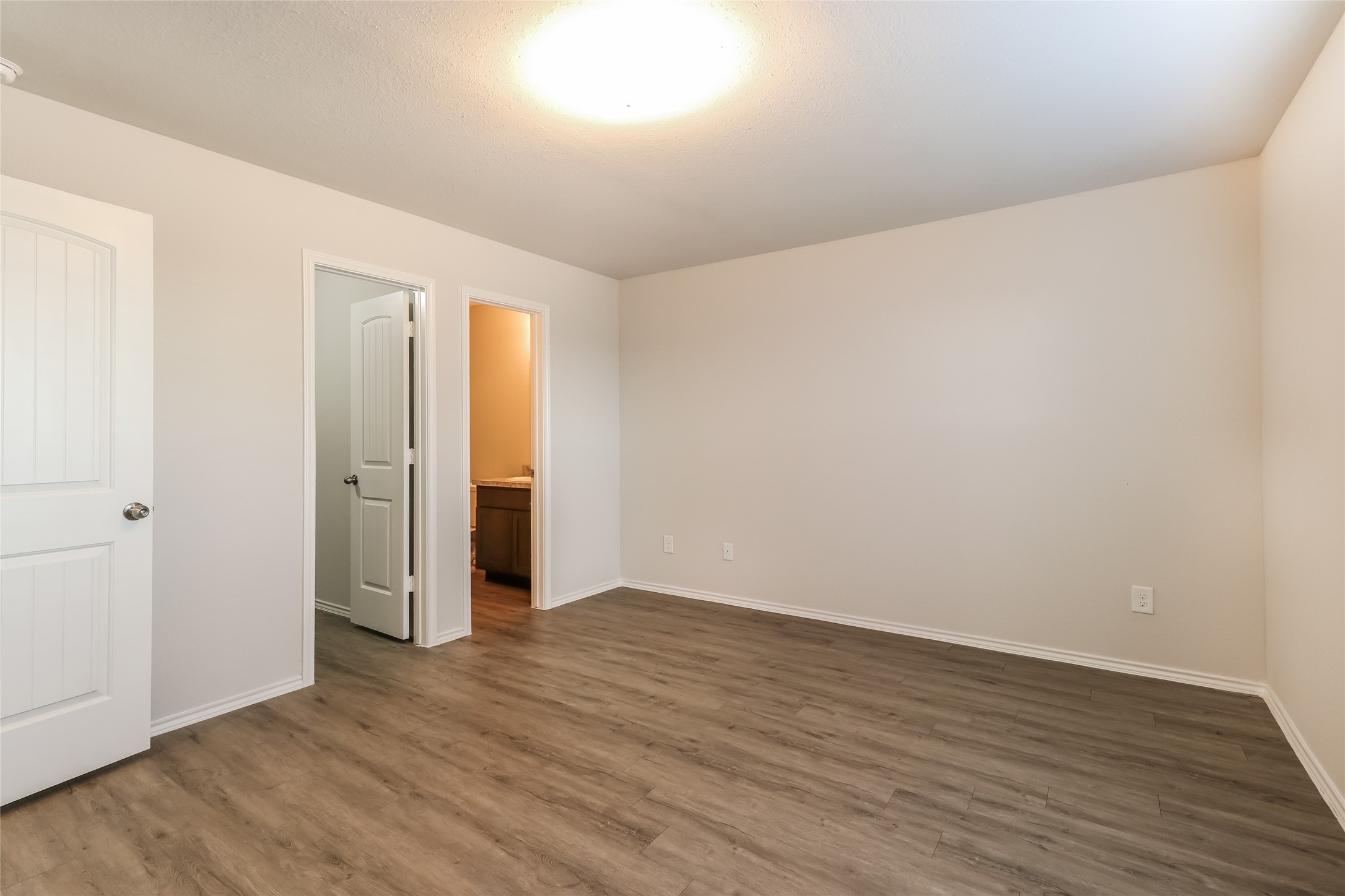 3229 Chunk Court Conroe, TX 77301 - Photo 9 of 18 a view of an empty room with wooden floor and closet