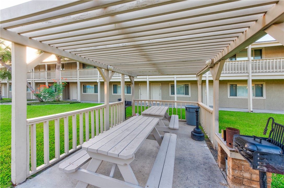 622 Beach Access Road, Unit 228 Port Aransas, TX 78373 - Photo 12 of 12 a front view of a house with a patio