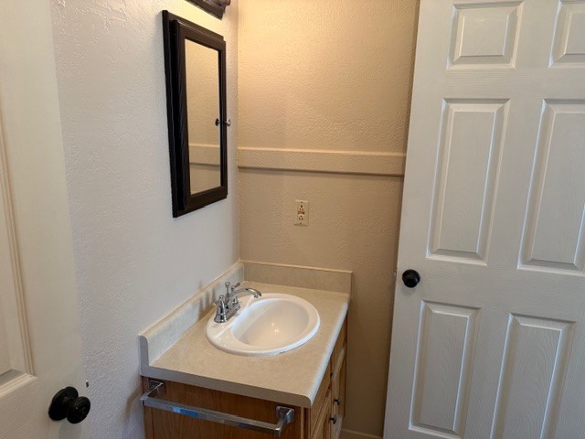 622 Beach Access Road, Unit 228 Port Aransas, TX 78373 - Photo 6 of 12 a bathroom with a sink and a mirror