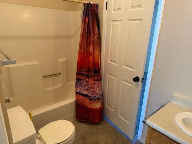 a bathroom with a sink and toilet