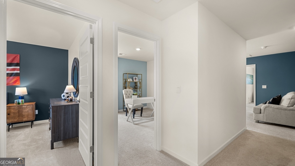 11940 Aukerman Way Hampton, GA 30228 - Photo 16 of 32 a living room with furniture and a chandelier