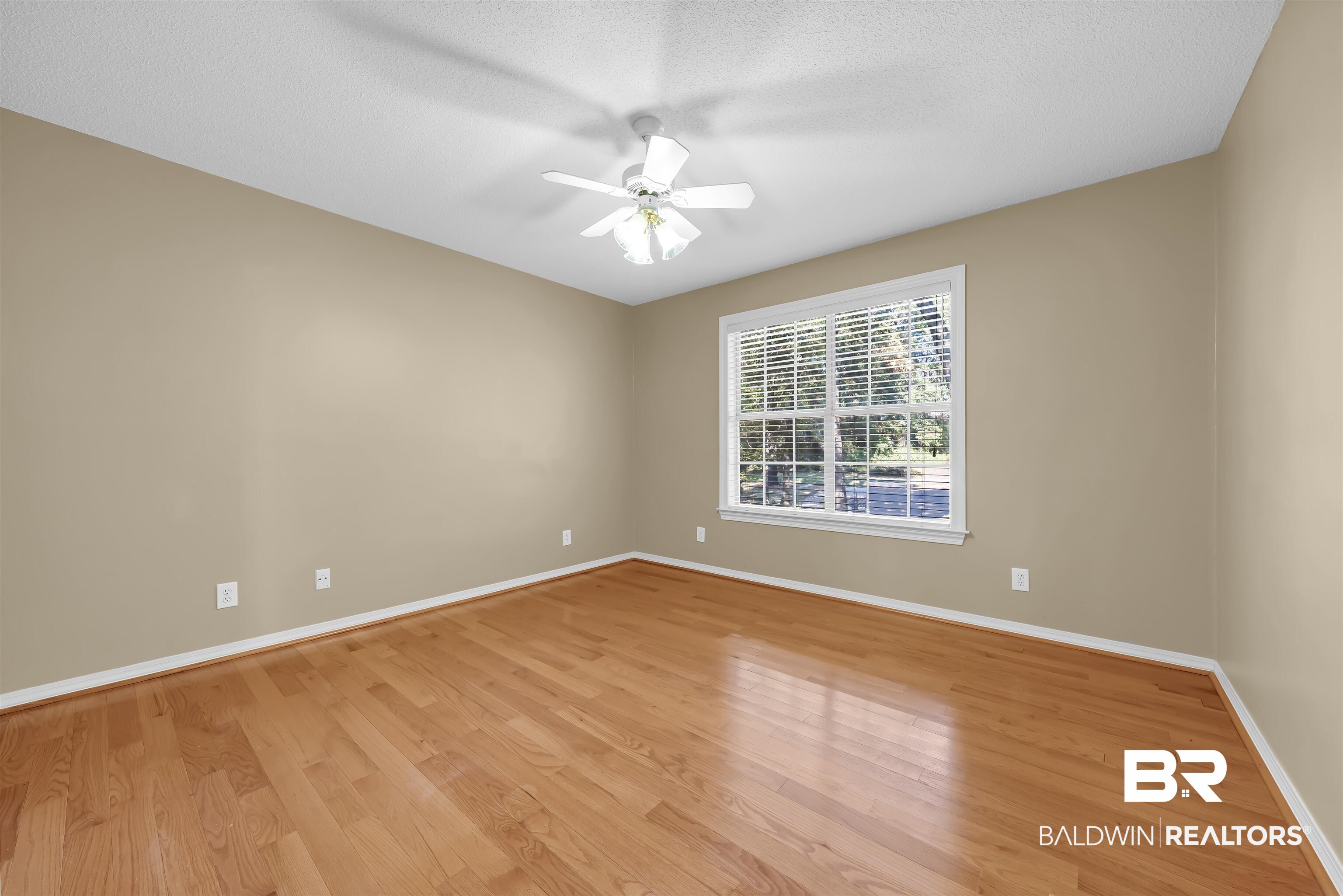 1262 Patrick Street Daphne, AL 36526 - Photo 23 of 35 Empty room with light wood-style floors, a textured ceiling, and ceiling fan