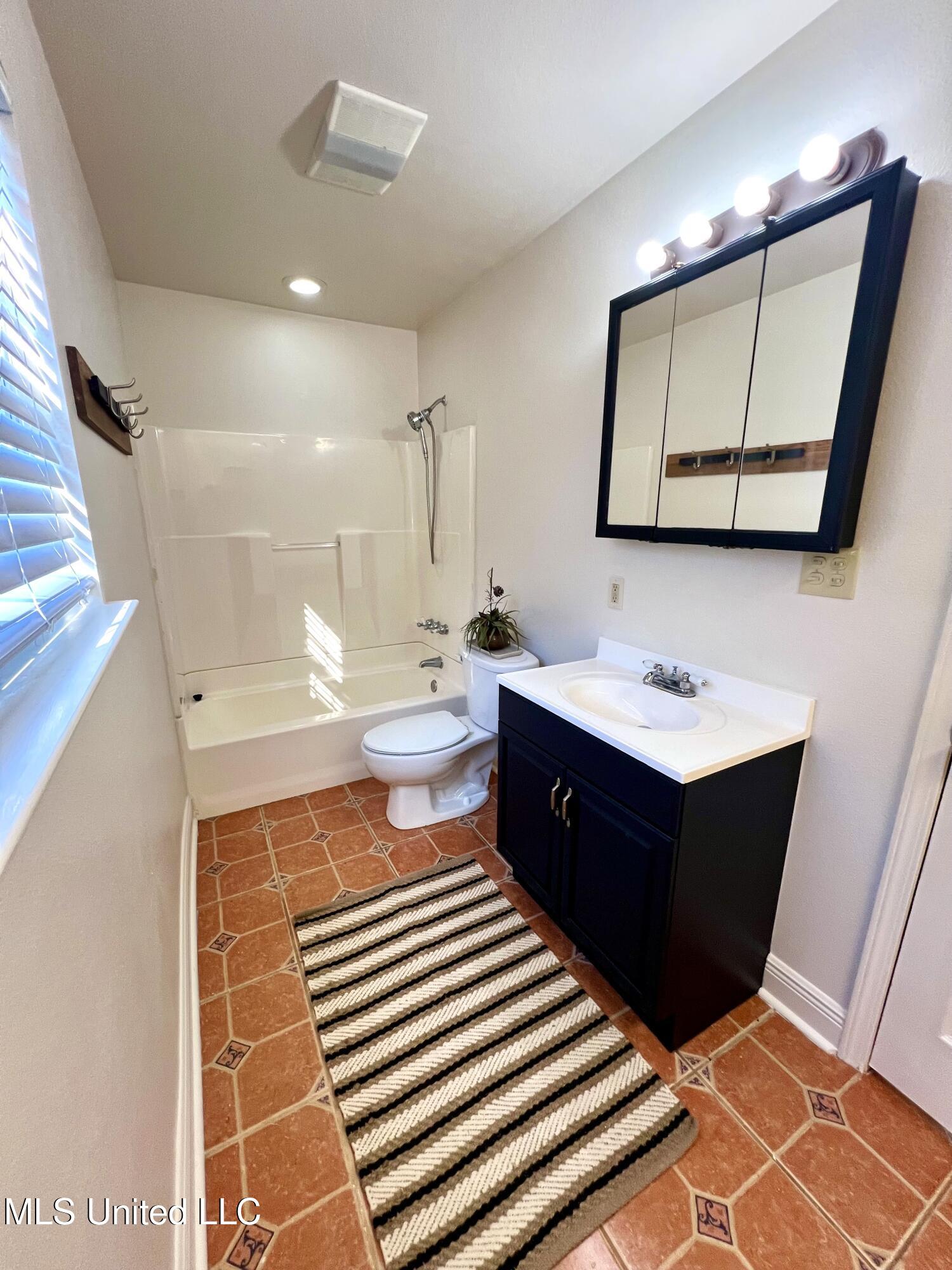 1185 Holden Road Poplarville, MS 39470 - Photo 15 of 21 Vanity & Tub