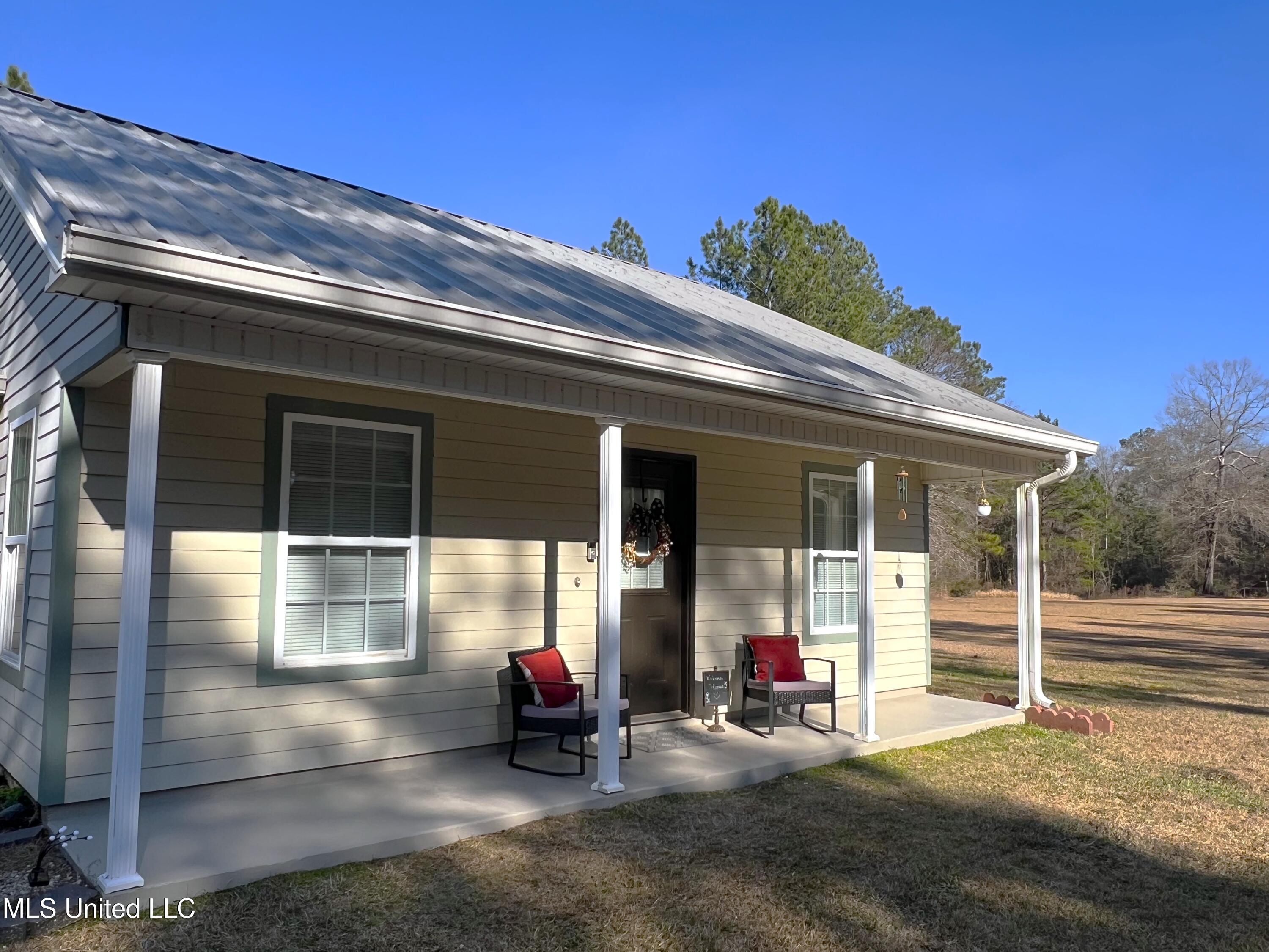 1185 Holden Road Poplarville, MS 39470 - Photo 2 of 21 Side of front