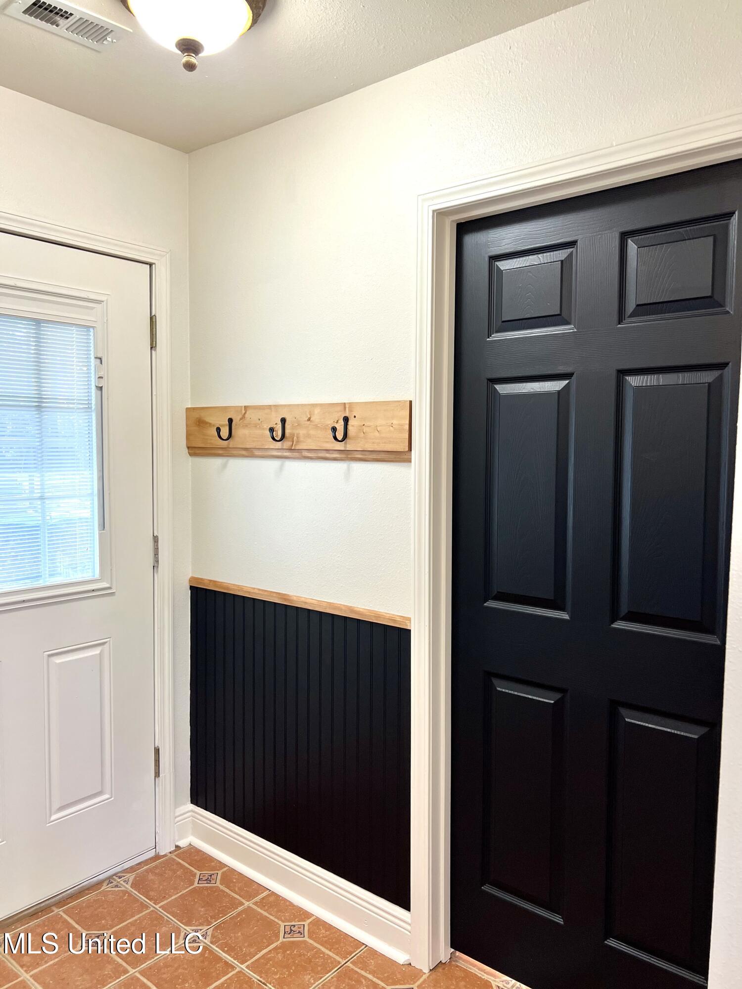 1185 Holden Road Poplarville, MS 39470 - Photo 8 of 21 Side Entrance and Bathroom Door