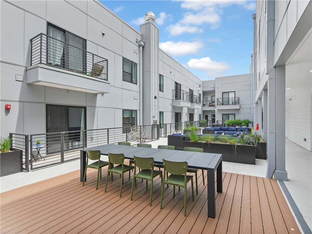 2220 Webberville Road, Unit 308 Austin, TX 78702 - Photo 12 of 21 Outdoor courtyard with artificial turf area and areas to hang out with friends